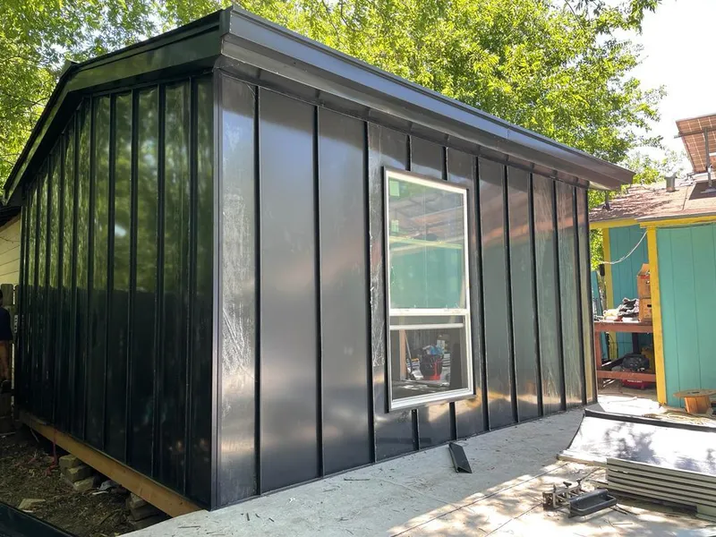 Black standing seam metal wall panels for Roof Inspection in Cabot