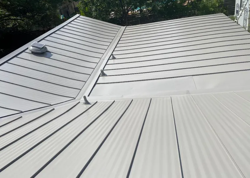 Solar attic fan installed on a metal roof for Roof Ventilation in Cabot
